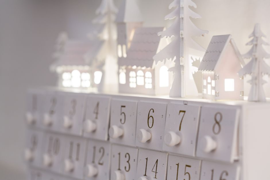 A Birch Plywood Advent Calendar with Twenty-Four Drawers