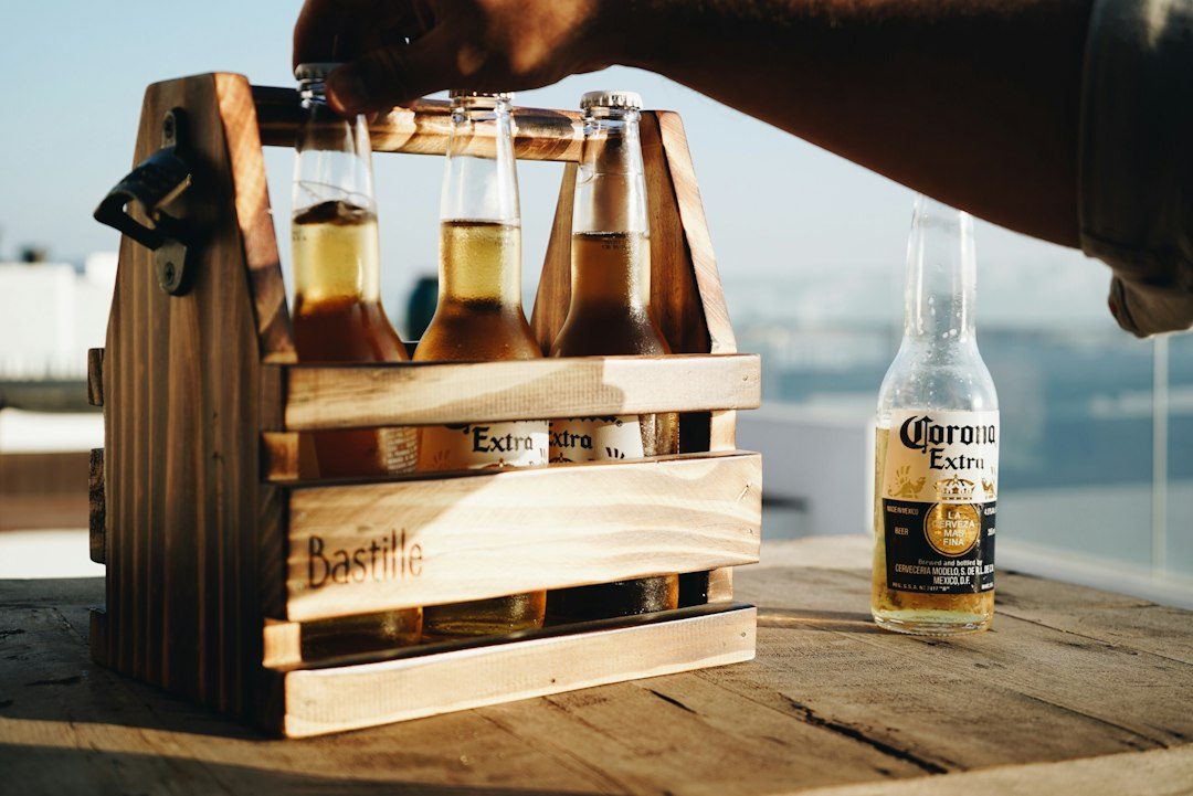 A Pine Six-Bottle Caddy with a Bottle Opener
